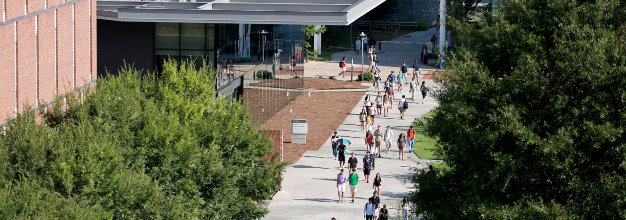 image of students walking around college campus
